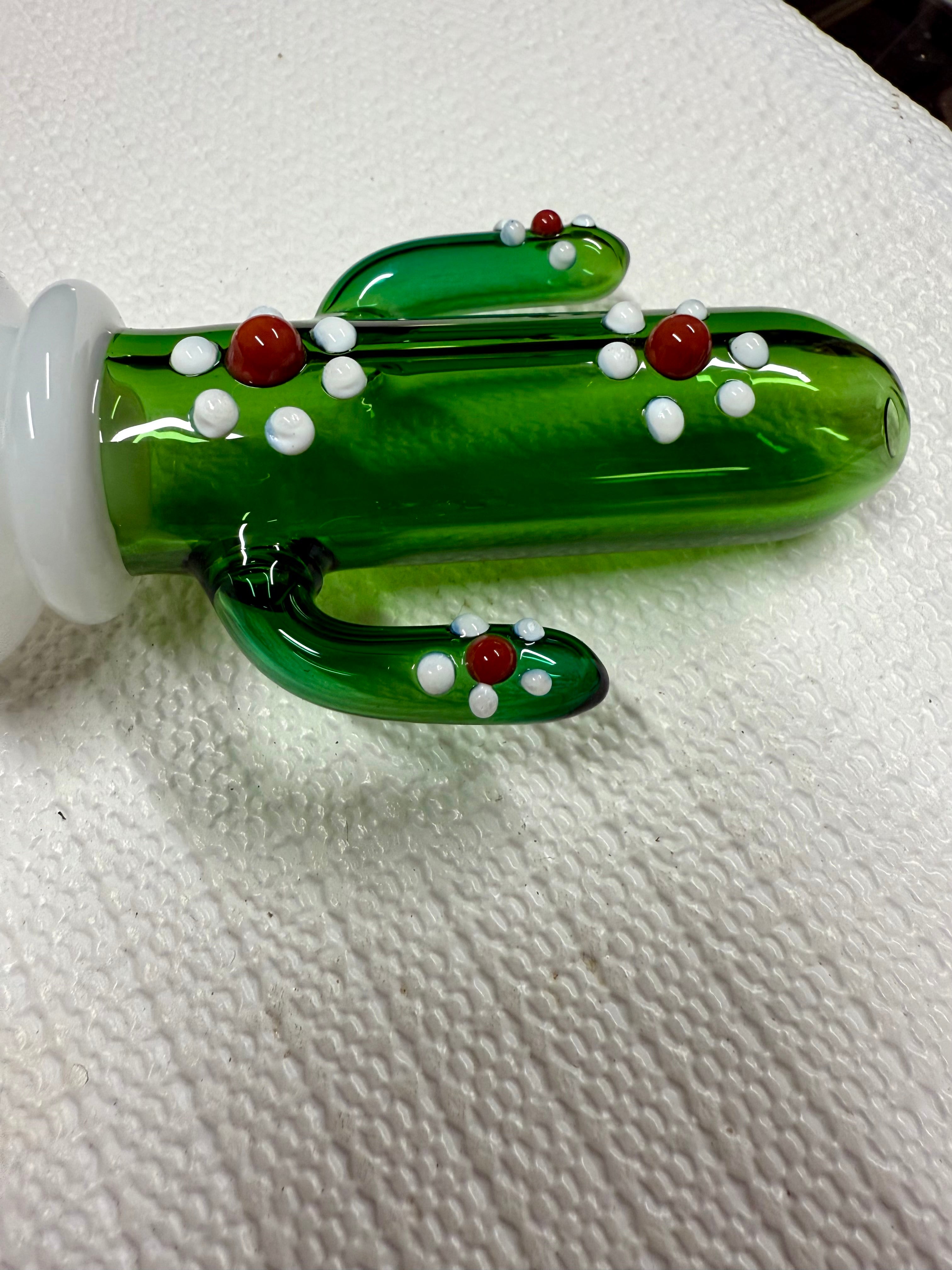 Ripkitty 4.5" cactus glass spoon pipe — close-up of milky white opal bowl chamber with green saguaro cactus body and white dot nodule detail, white background