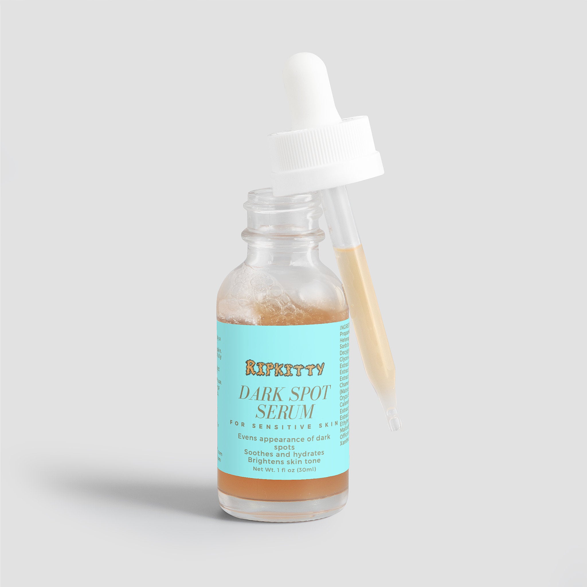 Bottle of Riptitty Dark Spot Serum on a light gray background
