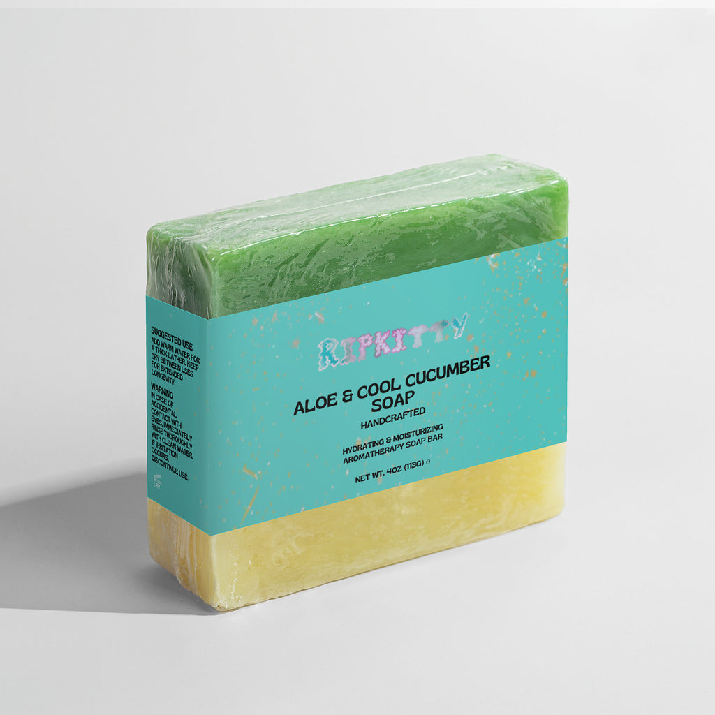 Bar of soap with a green top and yellow bottom on a light gray background