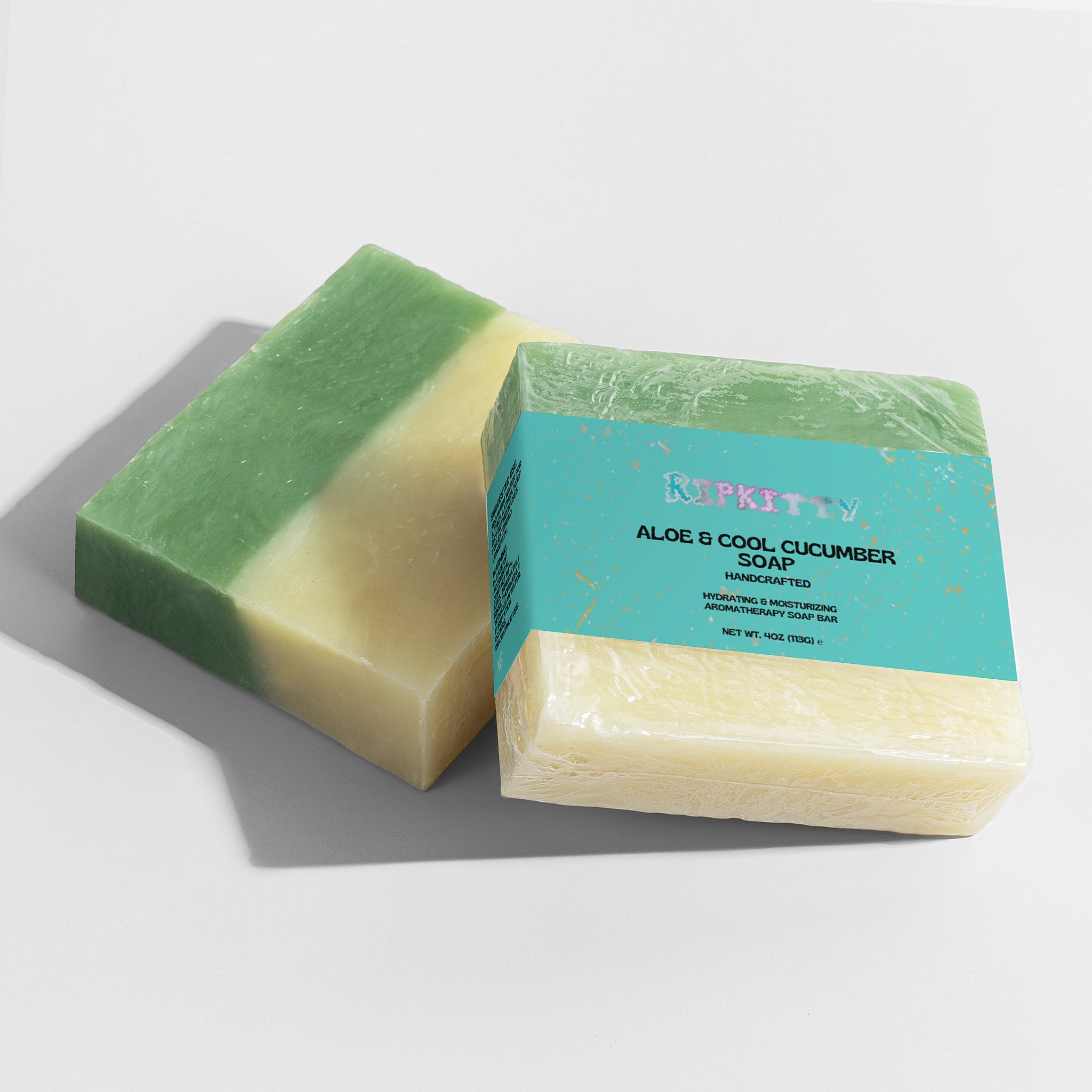 Green and beige soap bar with a blue label on a light gray background