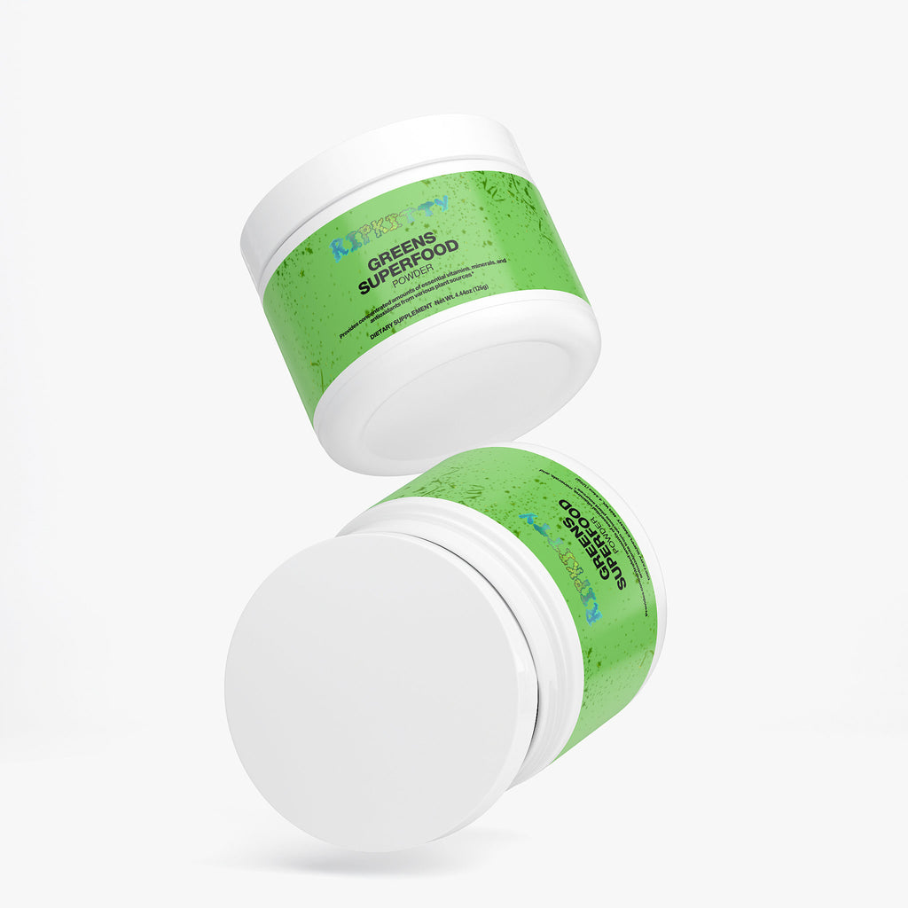 Two containers of 'Green Superfood' on a white background