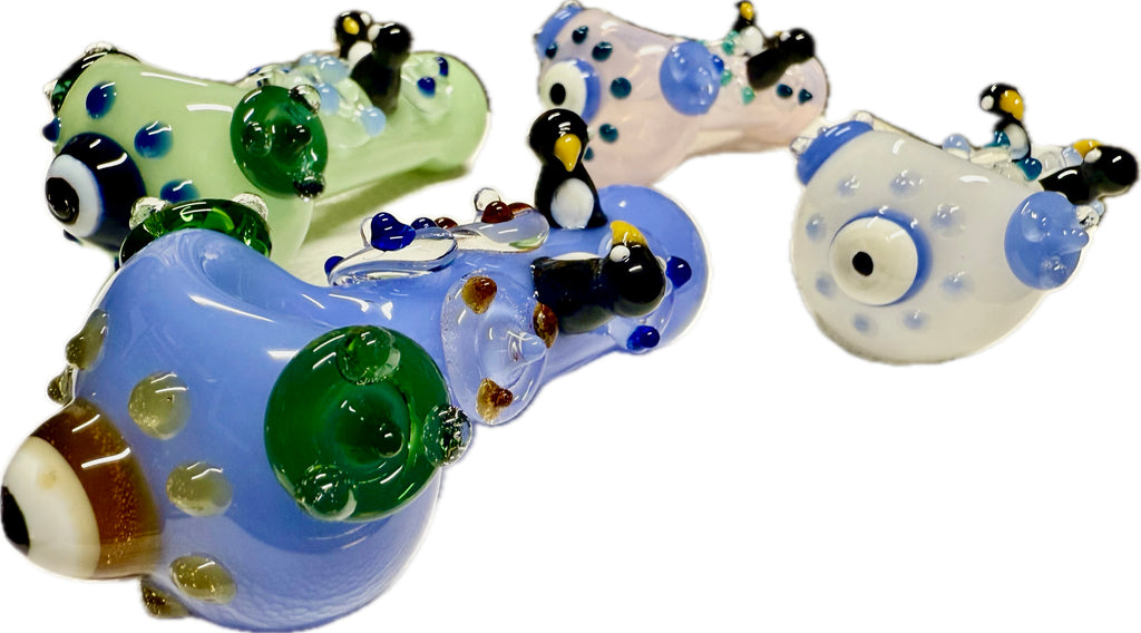 Ripkitty penguin art glass pipe — angled side view showing penguin sculpts and full pipe profile of all pipes, white background