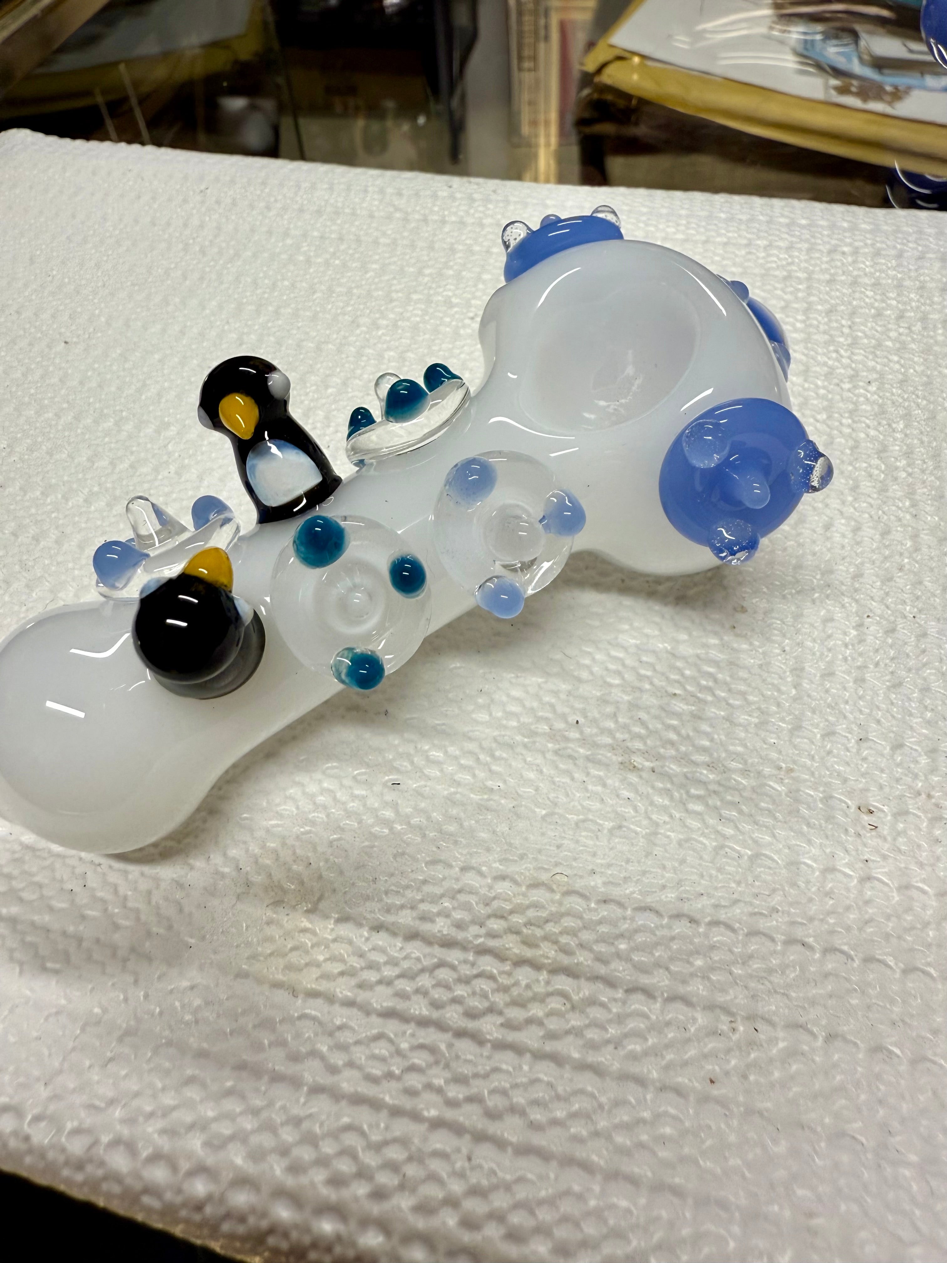  Ripkitty 4.5" penguin art pipe — white colorway, angled view showing penguin trio sculpts and blue polka dot body