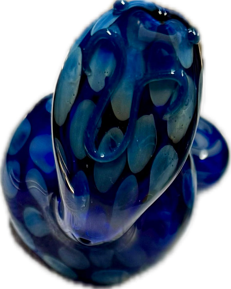 Top-down close-up of Ripkitty 5" COBRA glass pipe in deep navy blue — spotted scale pattern and swirl detailing on cobra head bowl