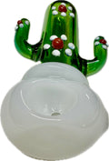 Ripkitty 4.5" cactus glass spoon pipe — front-facing view of green saguaro cactus body with white dot nodules and red bead accents, milky white opal bowl, white background