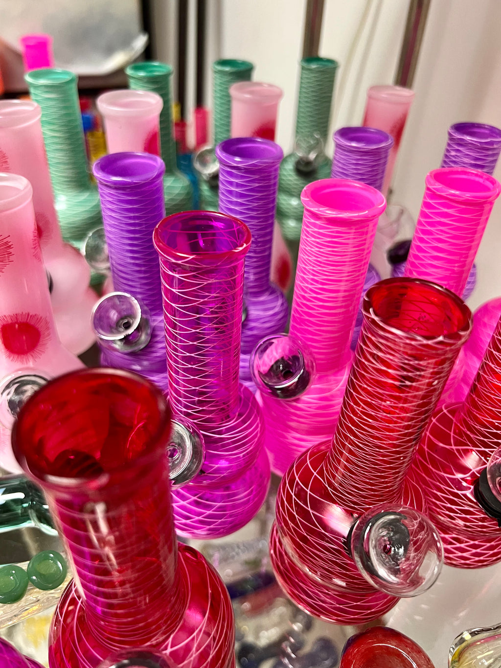 Assortment of Ripkitty 5-inch soft glass net water pipes in multiple colorways including pink, purple, teal, and red, showing randomized color variety