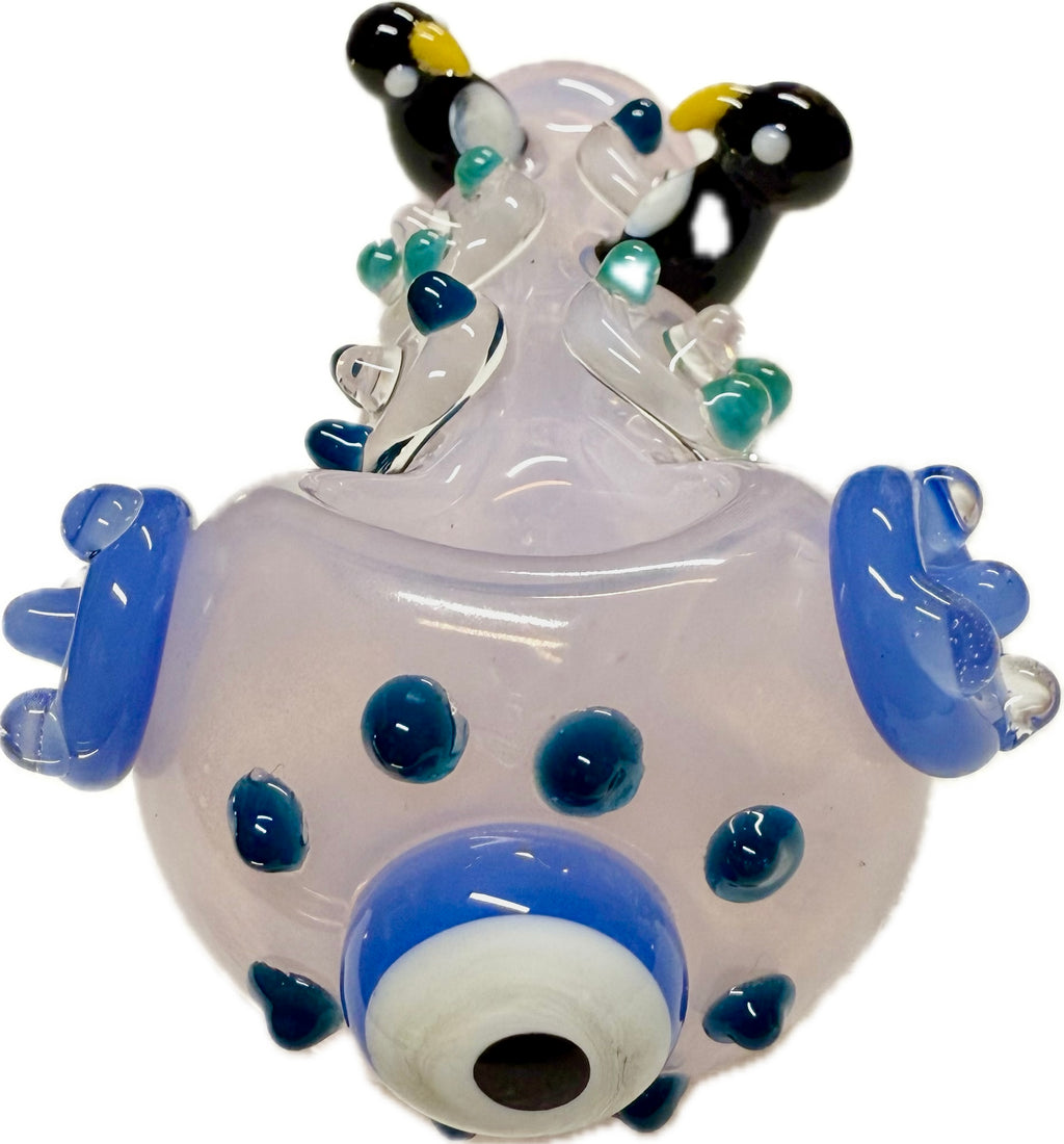  Ripkitty penguin art glass pipe — frosted pink body with blue accents, front bowl view showing evil eye accent and teal dot pattern, white background