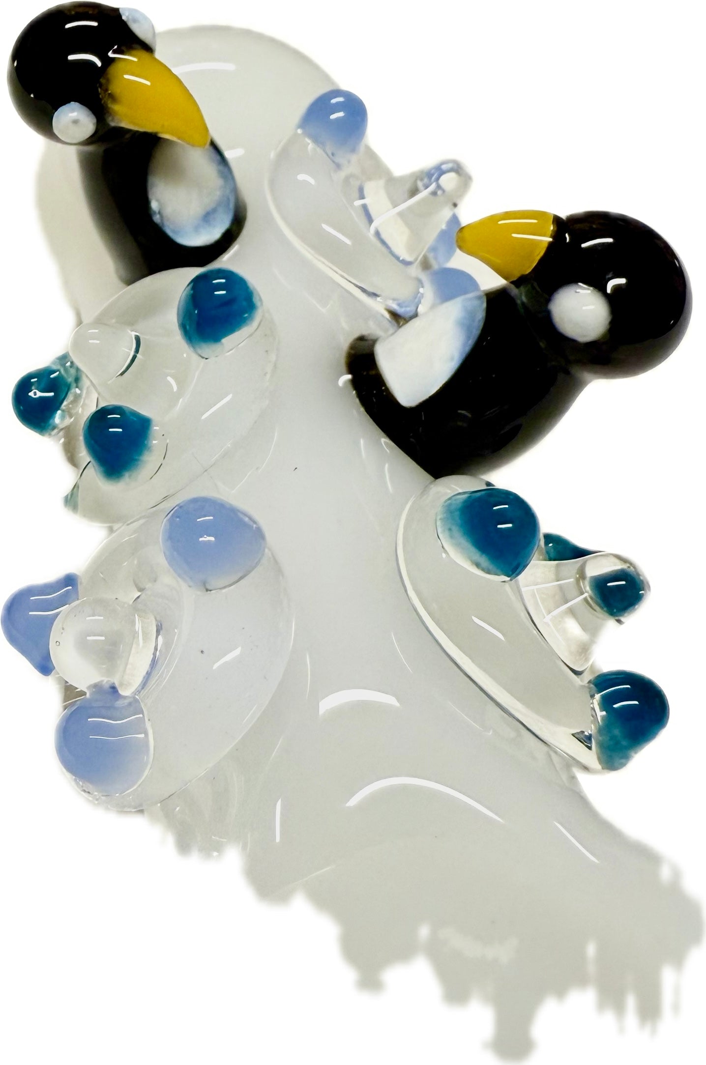 Ripkitty 4.5" penguin art pipe — frosted clear colorway, angled view showing penguin sculpts