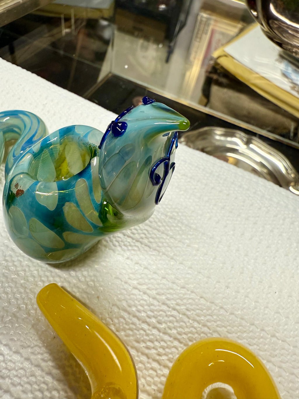 Top-down view of Ripkitty 5" COBRA borosilicate glass pipe — cobra head bowl and coiled neck detail, blue & green assorted colorway