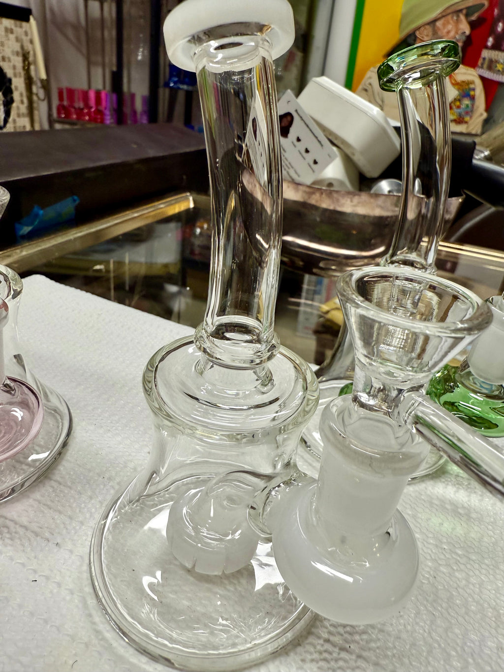 Ripkitty 7" conical bong — color shower neck, green base accent, side profile showing full conical form with bell base and percolator disc