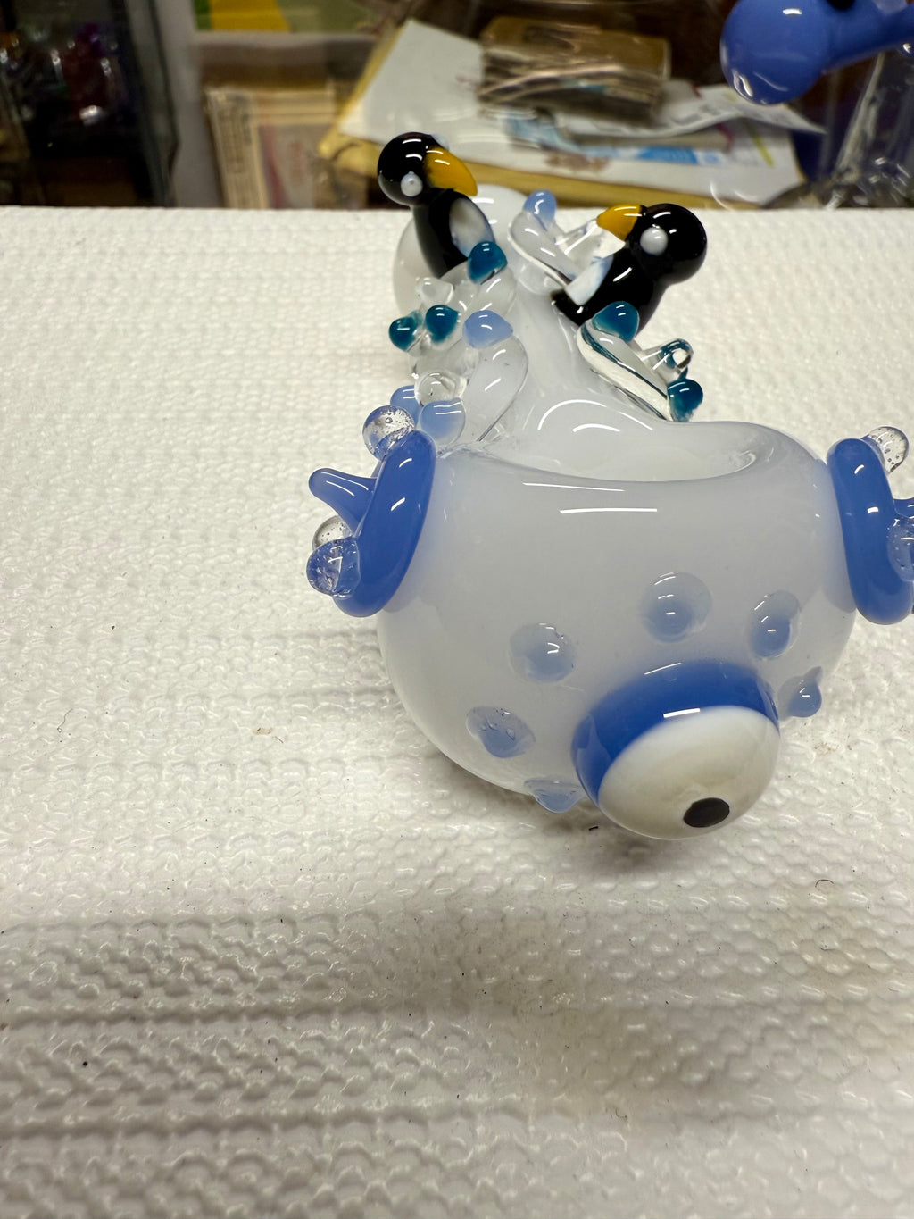 Ripkitty 4.5" penguin art pipe — white colorway, angled view showing penguin trio sculpts and blue polka dot body